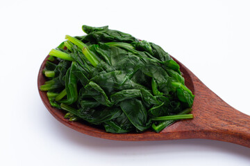 Boiled spinach on white background.