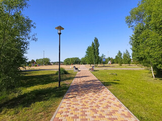 Walking path in the city park. outdoor recreation