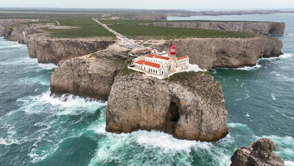 Cabo De Sao Vicente headland and its lighthouse of Vila do Bispo, in the Algarve, southern Portugal. Aerial