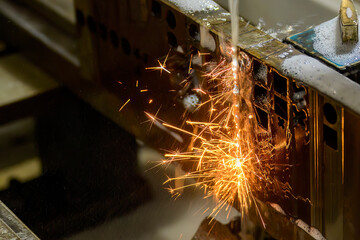 Closeup scene the wire EDM machine cutting the mold insert parts.