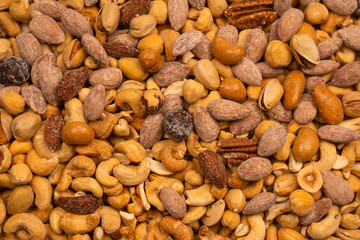 A group of almonds, pistachios, walnuts, macadamia, cashews.