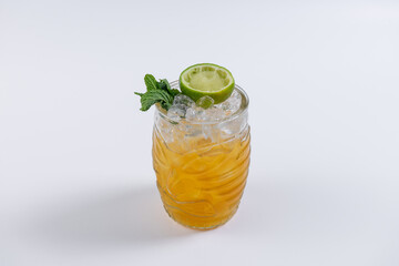 fresh alcoholic cocktail with lime, mint and ice on white background