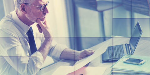 Businessman checking a document, geometric pattern