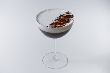 espresso martini cocktail in glass on white background