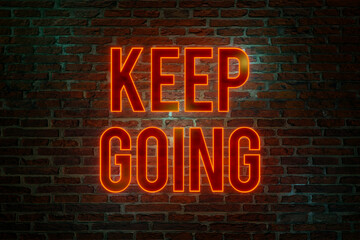 Keep going, neon sign. Brick wall at night with the text "Keep Going" in orange neon letters. The way forward, continuity, motivation, positive emotion, inspiration and encouragement. 3D illustration 