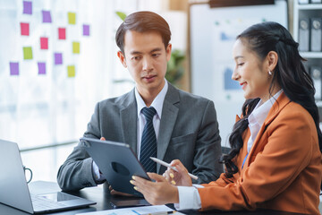 Asian business team discuss with new startup project Idea presentation, analyze planning and financial statistics and investment market at office.