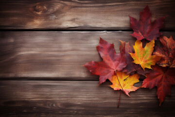 Naklejka na ściany i meble Autumn leaves over wooden background with copy space