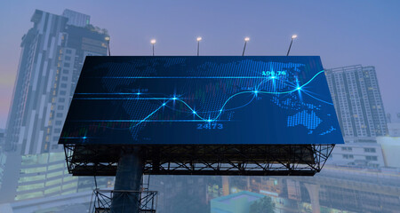 The concept of fundamental analysis. FOREX chart hologram on billboard, aerial night view of Bangkok It is a place developed.