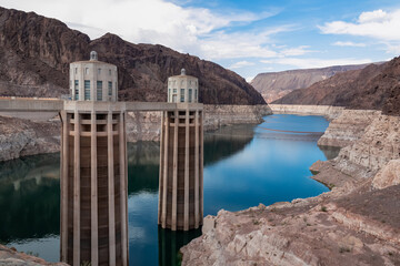 Scenic view of the wall of Hoover Dam next to Tillman Memorial Bridge, Nevada Arizona state line, USA. Renewable energy plant in Lake Mead National Recreation Area near Las Vegas. River reflection