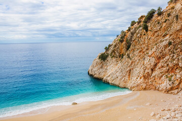 Beautiful bay with a beach and turquoise sea among big mountains. Kaputas beach, Kas, Türkiye.