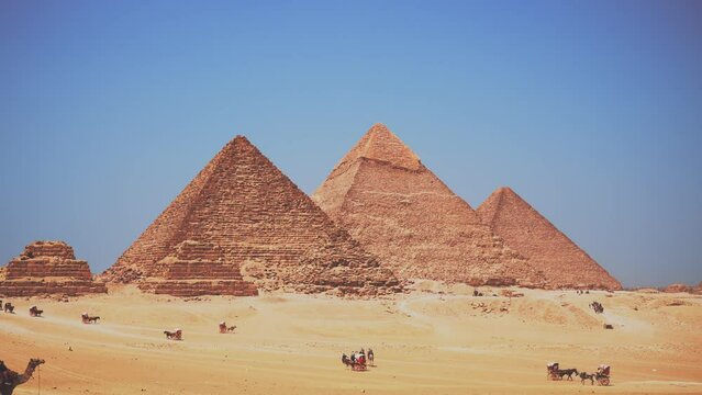 View of the pyramids of Giza in Egypt. Ancient sphinx and pyramids, symbol of Egypt. Beautiful pyramids of Egypt in Africa. A historic site right next door to Cairo and Giza in Africa.