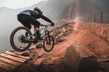 Fototapeta na wymiar Cyclist in the mountains, practicing Enduro MTB.