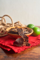 Dehydrated beef in a bowl, snack called beef jerky