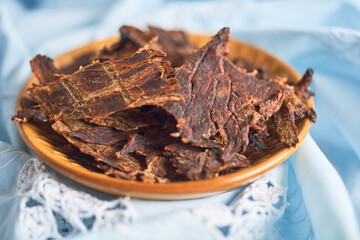 Dehydrated beef in a bowl, snack called beef jerky