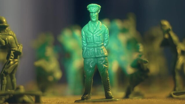 Reconstruction of war toy soldiers with army general in cente. Violence war resistance and peace without armored invasion