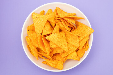 plate of corn chips nachos with guacamole on plate