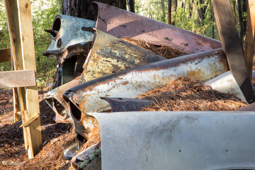 Old car parts in a junk yard