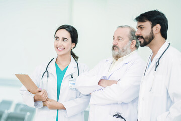 Fototapeta premium Professional Medical Doctors and team discussing in clinic hall, healthcare professionals having discussion in hospital corridor.