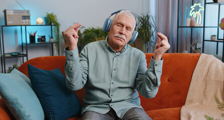 Keep calm down, relax, inner balance. Grandfather senior man breathes deeply with mudra gesture,...