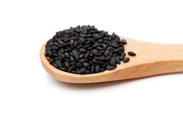 Wooden spoon with roasted sesame seed close up isolated on white background