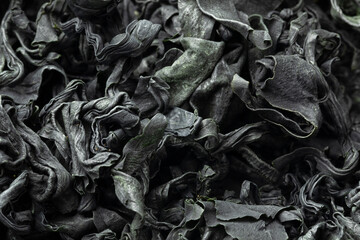 Cuts of dried wakame seaweed close up full frame as background © Picture Partners