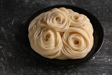 photo of cooked pasta lying in a plate