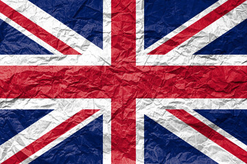 Flag of United Kingdom on crumpled paper. Textured background.