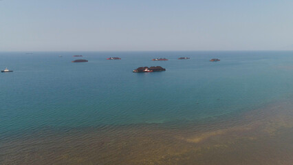 aerial view barges full coal anchored at sea near coal fired power station waiting be transported. coal barges and tugboats java, paiton indonesia