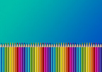 Colored pencil group isolated on blue. Horizontal background