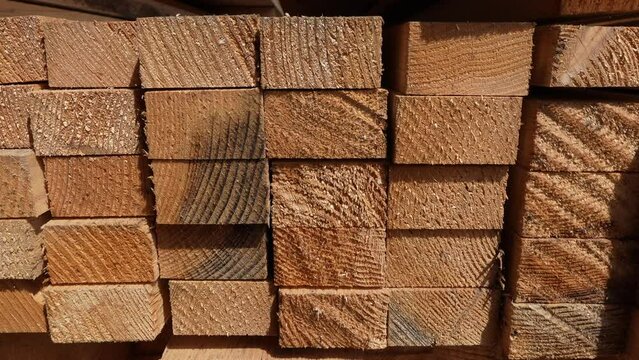 stack of Wooden boards lumber beams, industrial wood pine timber at warehouse