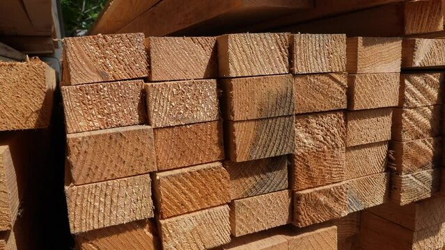 stack of Wooden boards lumber beams, industrial wood pine timber at warehouse