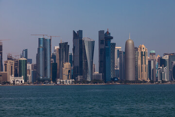 Obraz na płótnie Canvas Doha, Qatar - January 26 2023: A view of the sea and the towers in Doha, one of the most beautiful tourist places in Qatar 
