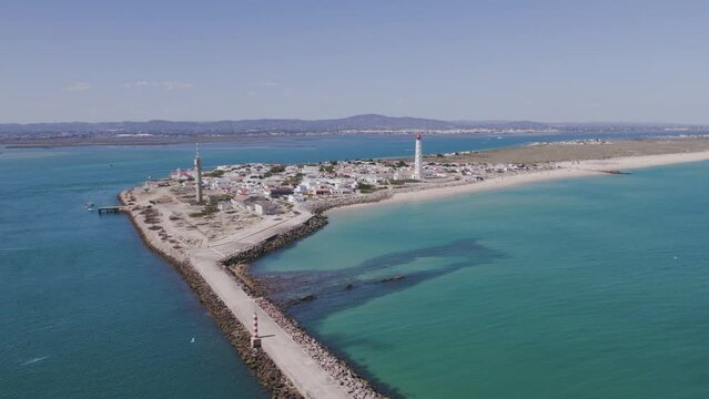Aerial seascape view of Ilha do Farol (lighthouse island), in Algarve Tourism Destination Region, in Portugal south coast.