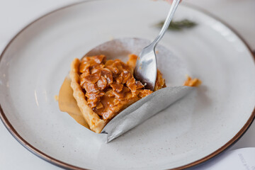 Almond Cake served with Plate , homemade coffee almonds cake 