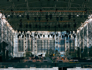 Stage with high technology in sound and lights, preparations for a great outdoor concert, metal structure and space for a rock band, space to enjoy shows and music in Latin America.
- 613595188