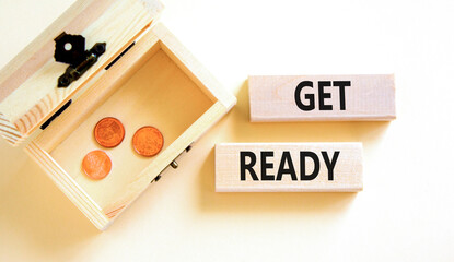 Get ready symbol. Concept words Get ready on wooden blocks on a beautiful white table white background. Wooden chest with coins. Business, support, motivation and get ready concept. Copy space.