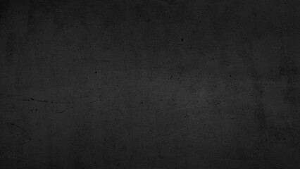 large dark black background image of rough raw concrete wall in loft style. modern black concrete wall decoration. cement floor texture use for background.