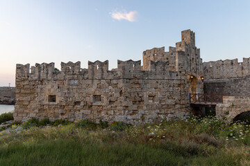 Fototapeta na wymiar Medieval stone structure in old harbor of Rhodes, Greece