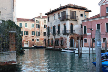 Colorful houses near water in the old medieval street in Venice isolated PNG photo with transparent background. High quality cut out scene element. Realistic image overlay