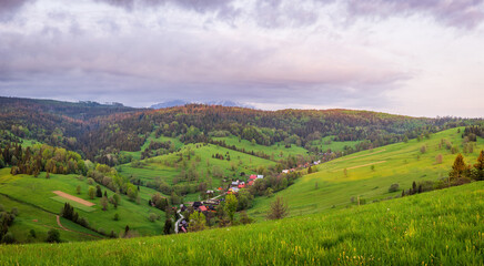 Belianske Tatry mountains and meadows over Osturna village in Slovakia