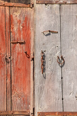 Old vintage wooden door with peeled paint.