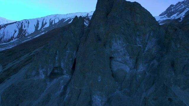 Aerial fast motion fly over dramatic Himalayas mountain peaks landscape in Nepal. Tilicho base camp trekking way in Himalayas.Annapurna circuit trek in early morning
