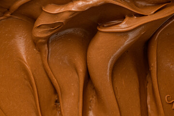 Chocolate ganache. milk chocolate cream to fill or decorate desserts or cakes. Top view