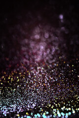 Blurred multicolor black background with glitter. Abstract space background with free space for your text, web design. . Christmas background.