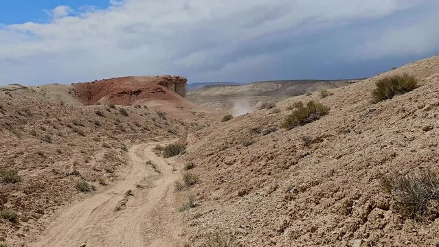 Drive Plate-Forward-Driving rough privative dirt road thru dry arid desert hills