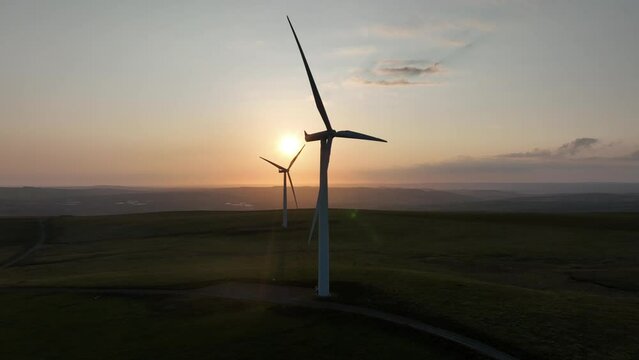 Wind farm sunset on Betws Mountain