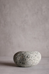 Minimal background for branding and product presentation.natural stone for product display on grey background.copy space.advertising and sale concept