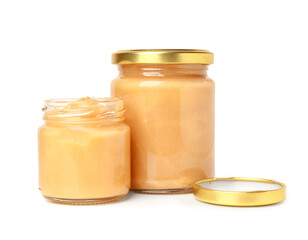 Jars of healthy baby puree on white background