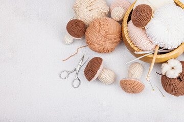 Set of clew of thread for knitting. Crocheted mushrooms, handmade, hobby concept. Props