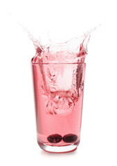 Glass of tasty blueberry cider with splashes, ice cube and berries isolated on white background